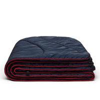 Rumpl Original Puffy Blanket 1 person deepwater folded