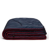 Rumpl Original Puffy Blanket 1 person deepwater folded
