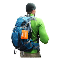 AMK SOL Emergency Poncho clipped onto backpack