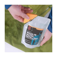 McNett Gear Aid Wash In Water Repellent next to jacket