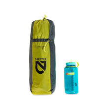 Nemo Dragonfly 3 Person Hiking Backpacking Tent packed in bag next to water bottle