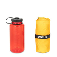 Nemo Tensor Inflatable Sleeping Mat Long Wide packed next to water bottle 