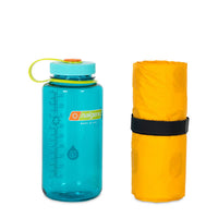 Nemo Tensor Ultralight Insulated Short Mummy Sleeping Mat packed next to water bottle