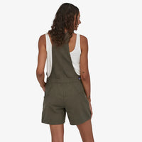 Patagonia Women's Stand Up Overalls in use rearr view basin green