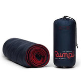 Rumpl Original Puffy Blanket 1 person deepwater rolled and in stuff sack