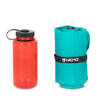 Nemo Astro Inflatable Insulated Sleeping Mat Regular packed next to water bottle