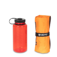 Nemo Tensor Alpine Ultralight Insulated Mountaineering Mat packed next to water bottle