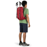 Osprey Skarab 22 Litre Men's Hydration Day Pack in use side view trekking poles attached at back