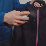 Revivex Durable Water Repellent Spray Bottle in use on jacket